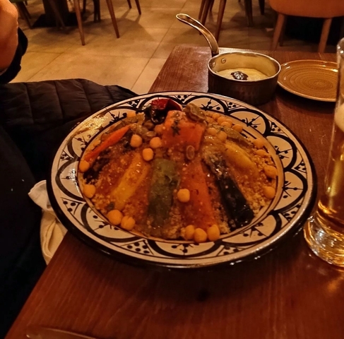       Traditional dish with couscous and roasted vegetables.
  