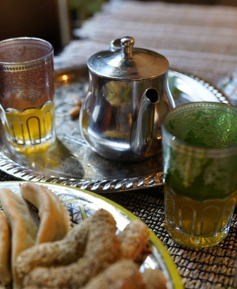       Moroccan tea setup with ornate tea glasses.
  