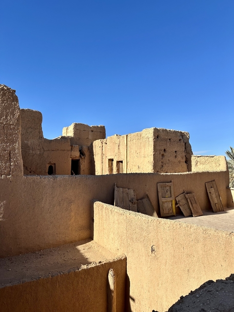       Traditional mudbrick architecture in a sunny setting.
  