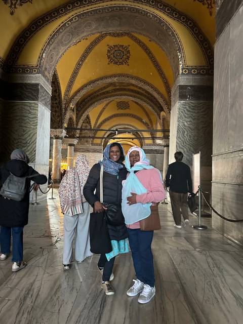       Upside-down image inside a historic building with intricate ceilings.
  
