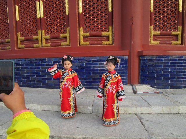 Children dressed in traditional attire posing.
