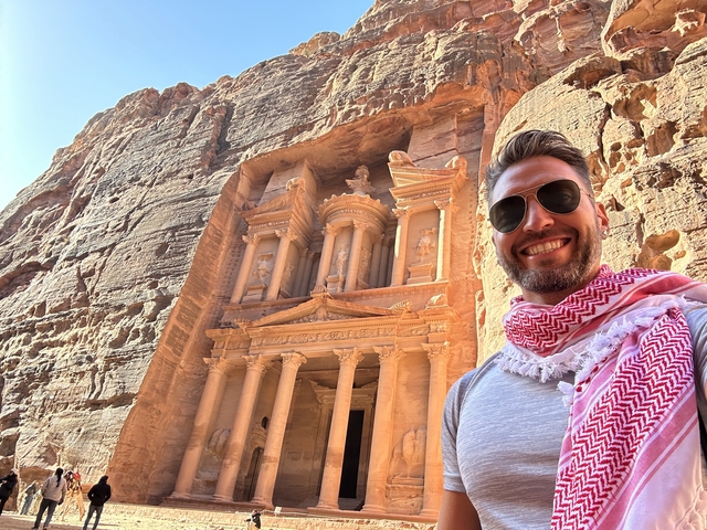       Person posing with Petra architecture
  