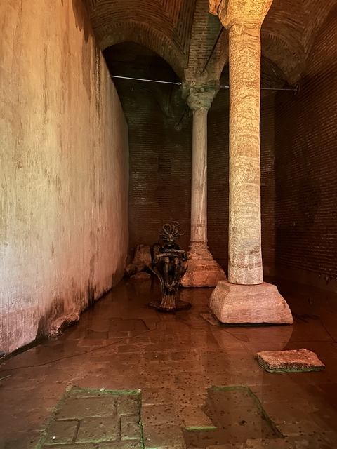       Underground structure with columns and sculpture
  