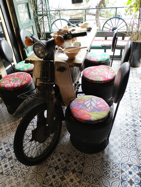       Decorative furniture made from motorcycle and tires.
  