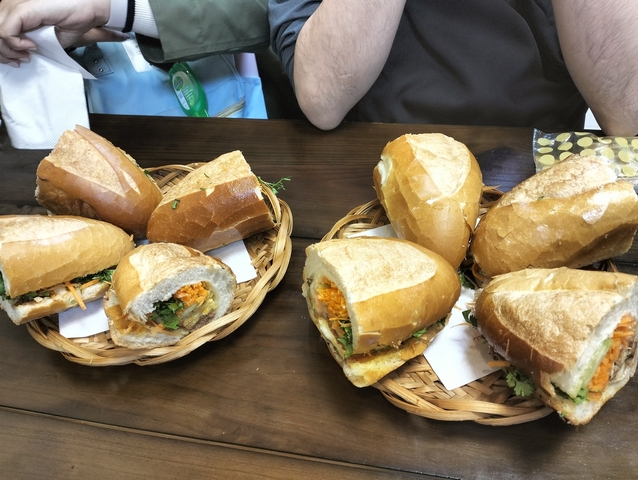       Baskets of sandwiches on a table.
  