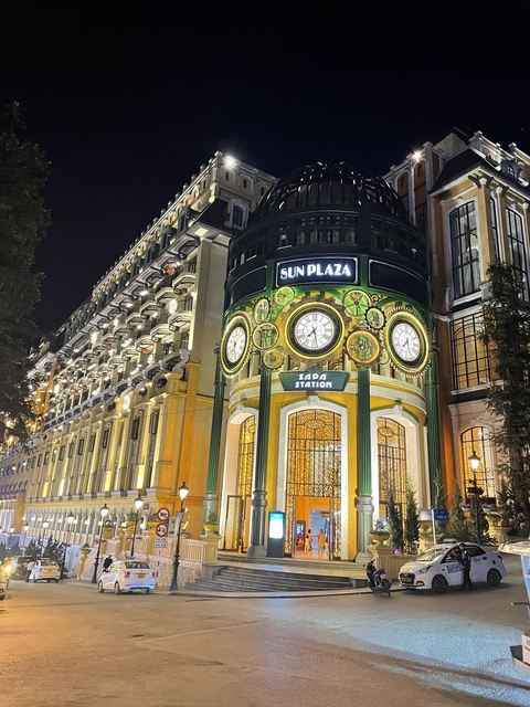       Illuminated 'Sun Plaza' shopping complex at night.
  
