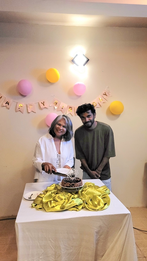       Two people celebrating a birthday indoors.
  