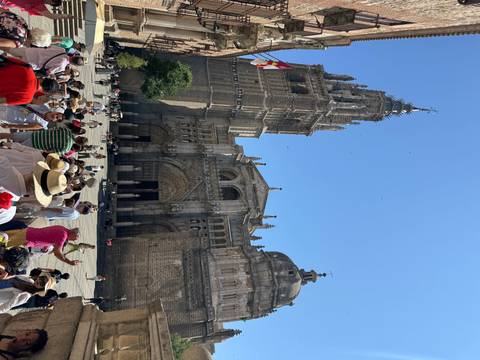People gathered outside a large cathedral.