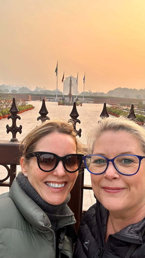       Two people taking a selfie near the monument.
  