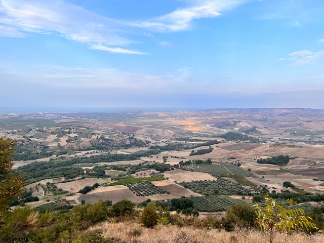 Panoramic view of rolling hills and farmland