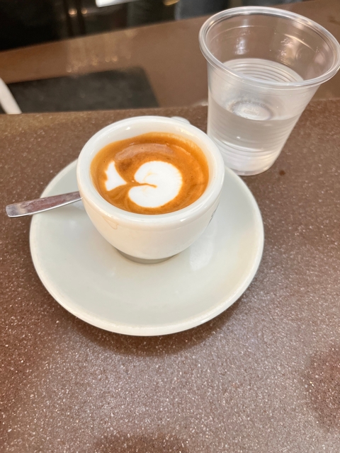 Cup of coffee with latte art on a table