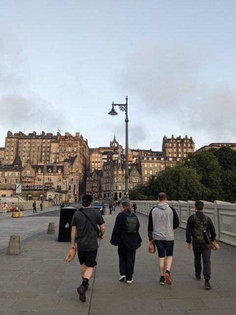 Street view with classic architecture and people walking.