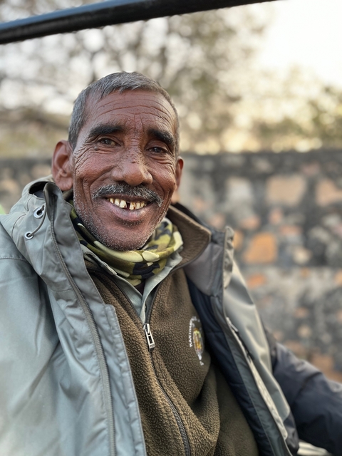 Close up of a smiling man outdoors.