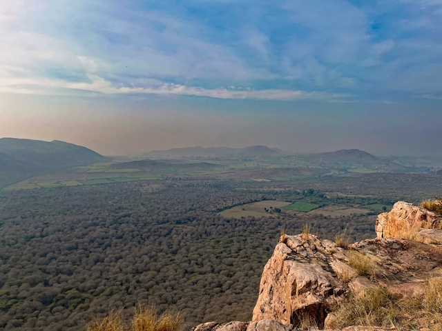 Panoramic view of the landscape with fields and mountains.