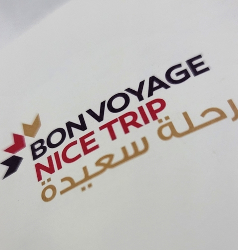       Sign with text 'Bon Voyage Nice Trip' in multiple languages.
  