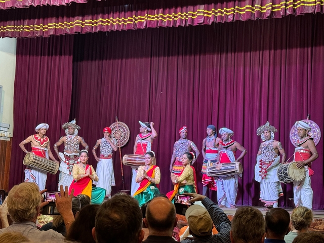       A traditional cultural performance with dancers.
  