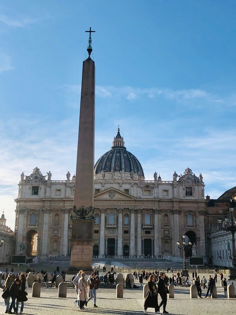      An architectural structure with a dome and obelisk, set against a blue sky.
  