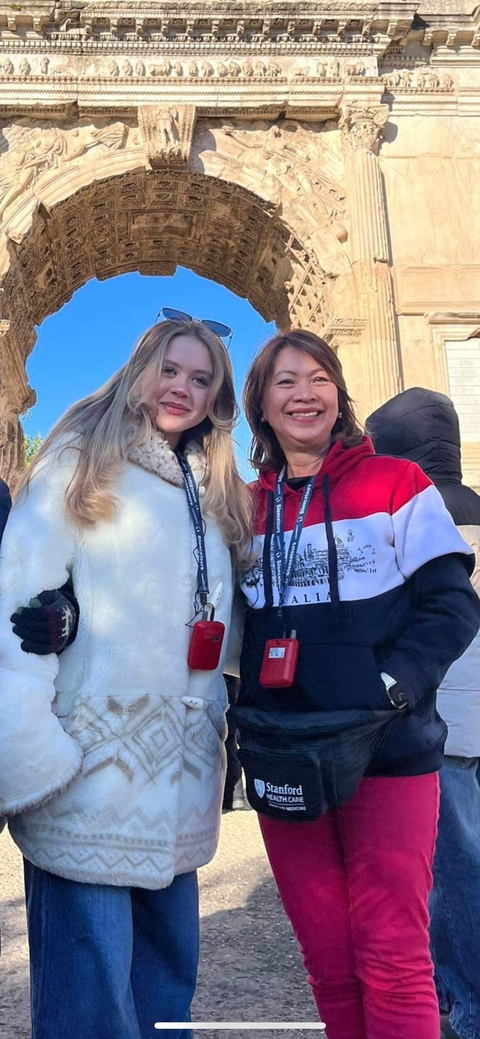       Two women smiling and posing for a picture.
  