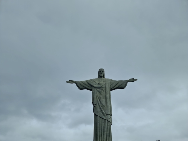 Christ the Redeemer statue under a cloudy sky