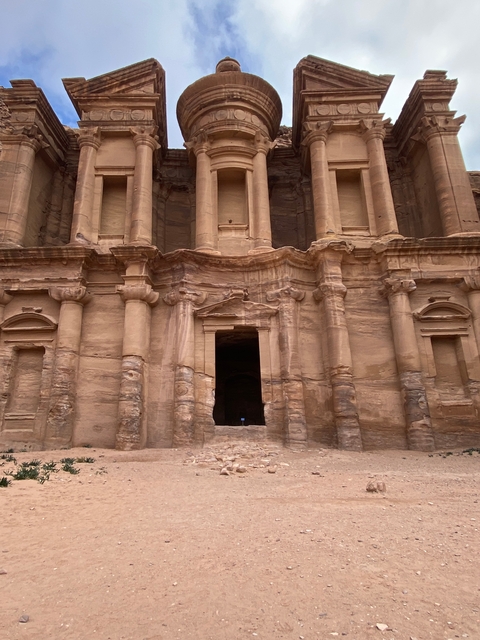 Facade of an ancient temple with intricate carvings.