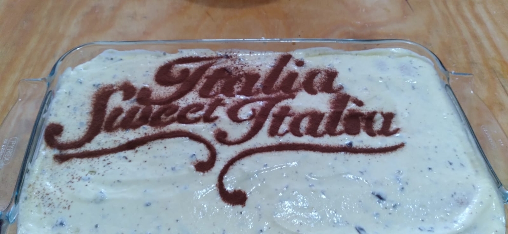 Dessert with decorative text 'Italia Sweet Italia' on top.