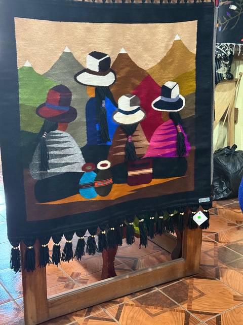       Colorful woven tapestry with traditional patterns.
  