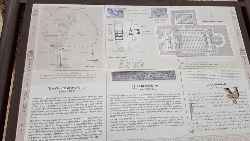       Information board with historical details in multiple languages.
  