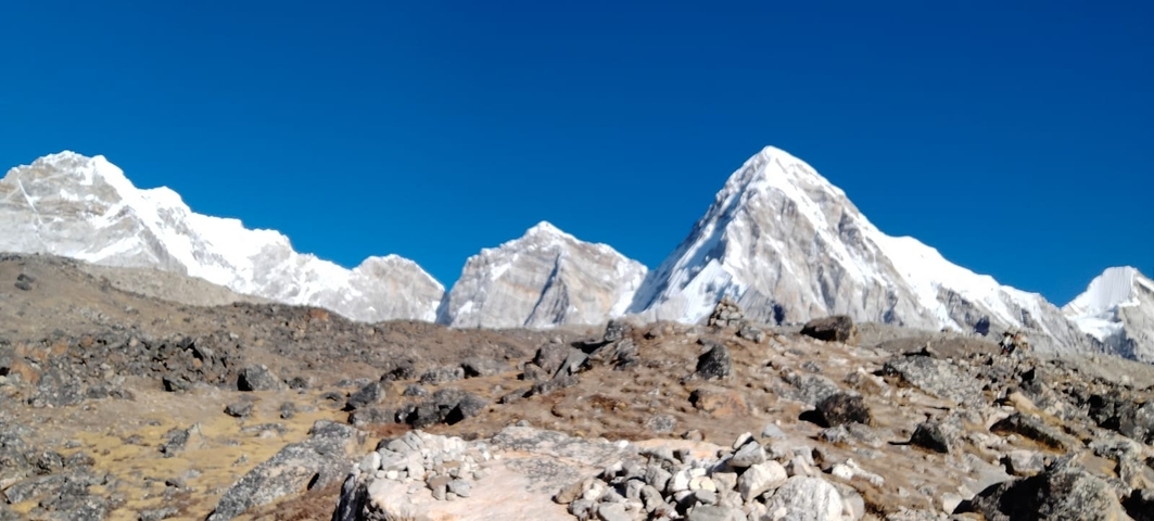 Snow-capped mountains under a clear blue sky.