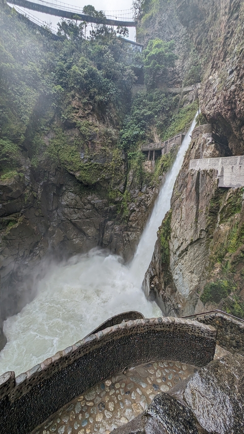       Large waterfall cascading down a rocky cliff.
  