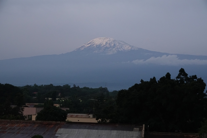       Mount Kilimanjaro with snowcap seen from afar.
  