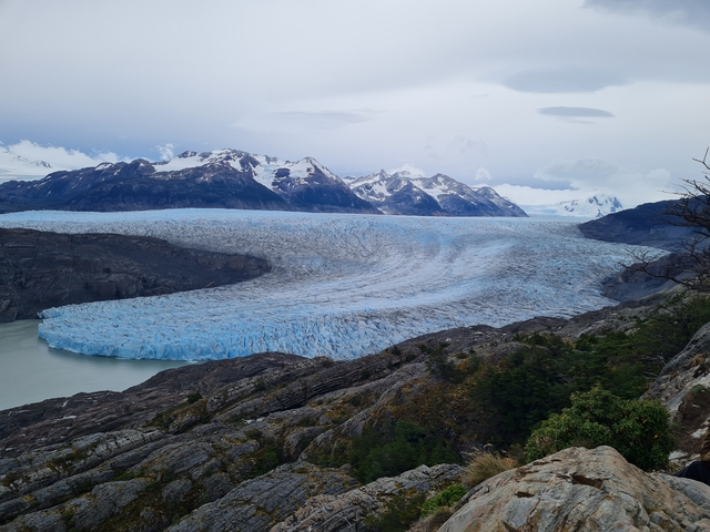 Large glacier descending into the water.