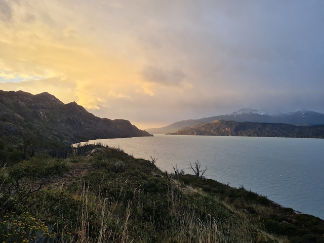       Beautiful lake with mountains at sunset.
  