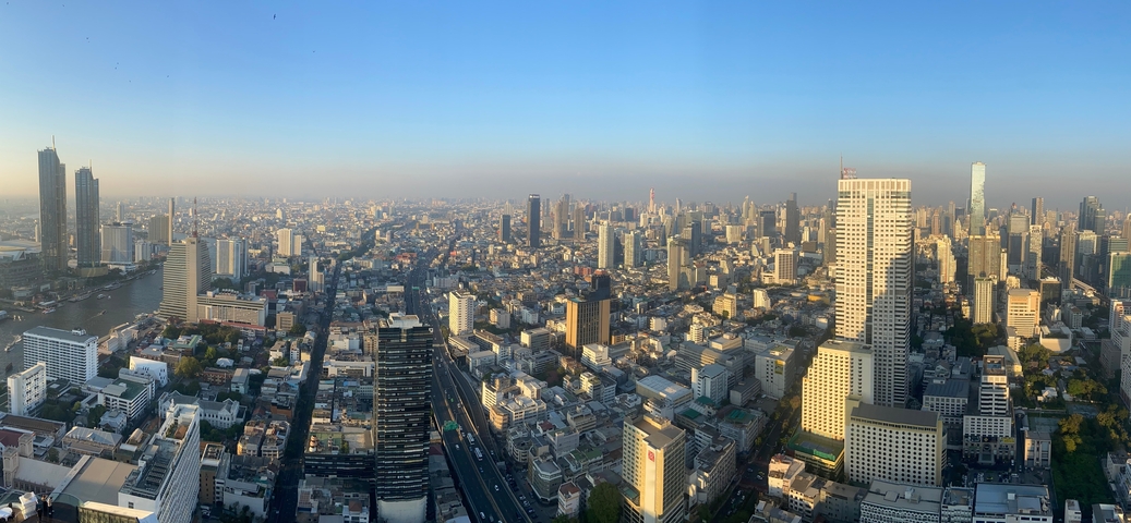 Panoramic view of a city skyline during the day.