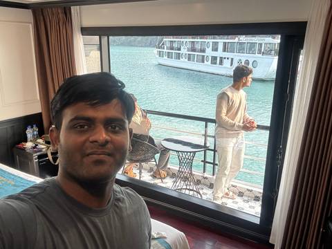 Upside-down view of people on a cruise ship enjoying the scenery.