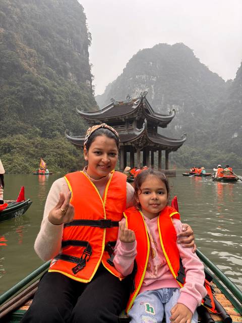 Upside-down image of a mother and child on a boat.