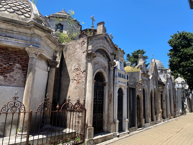       Historical cemetery with ornate tomb structures.
  