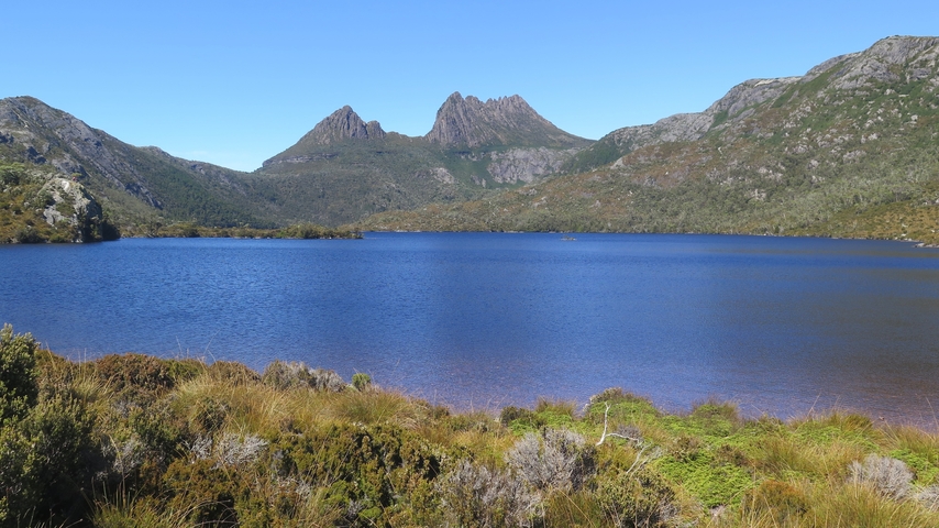 Lake with mountains in the background.