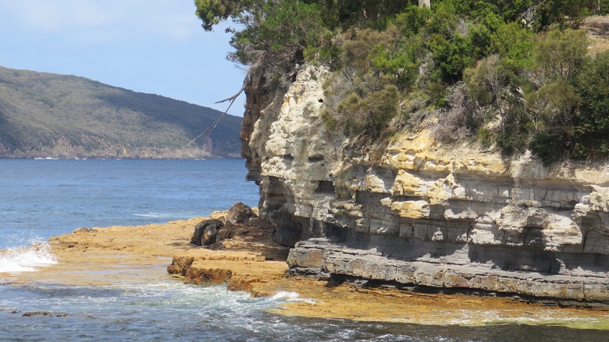 Scenic coastal landscape with cliffs and ocean.