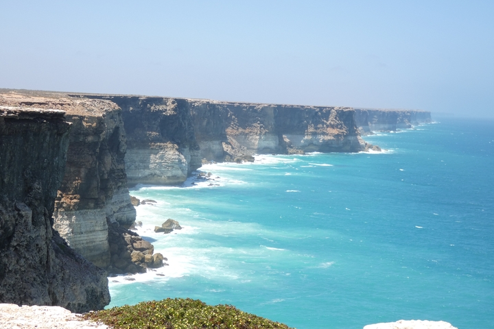 Stunning coastal cliffs with turquoise sea.