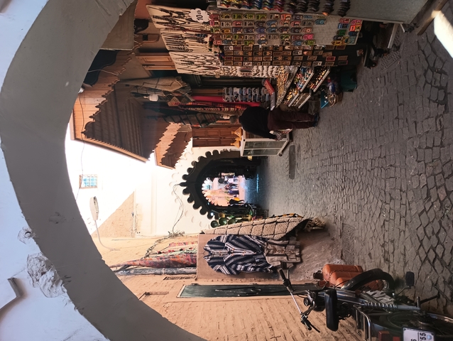 Narrow street market in a Moroccan medina.