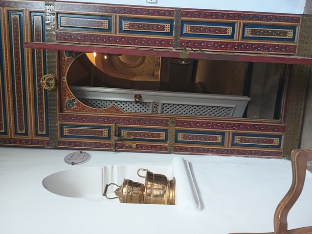 Intricately decorated wooden doors in traditional Moroccan style.