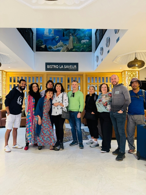 Group of people posing indoors.