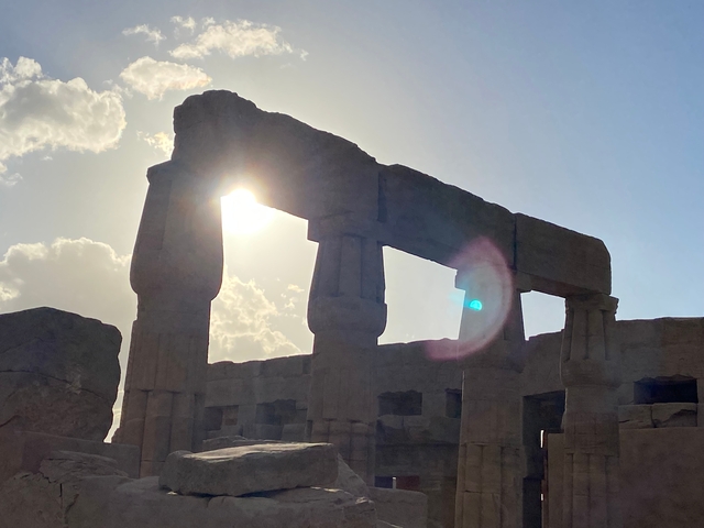 Ancient structure with sunlight peeking through.