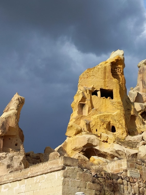 Rock formations under a cloudy sky.