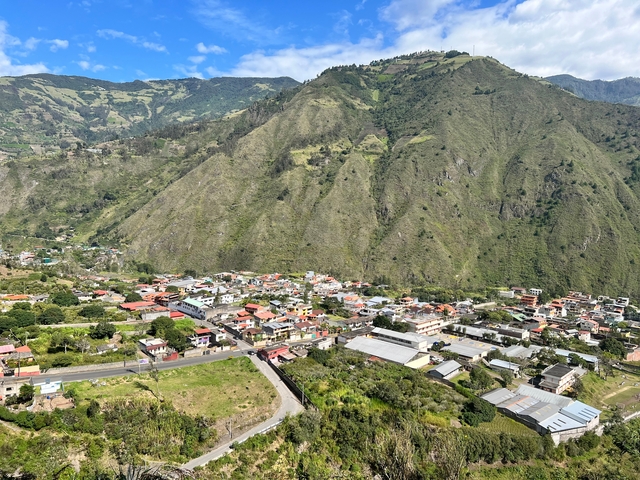 Aerial view of a town nestled in a valley.