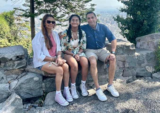       Group portrait with cityscape in the background.
  