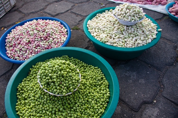 Baskets of fresh produce on display at a market.