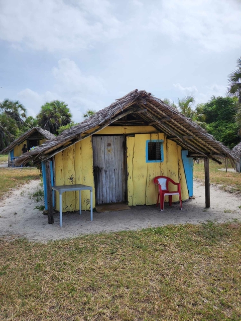 Rustic wooden hut on the beach.