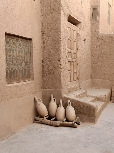       Close-up of pottery against a wall.
  