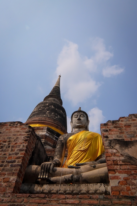       Statue of a Buddha with a stupa in Wat Yai Chai Mongkhon.
  